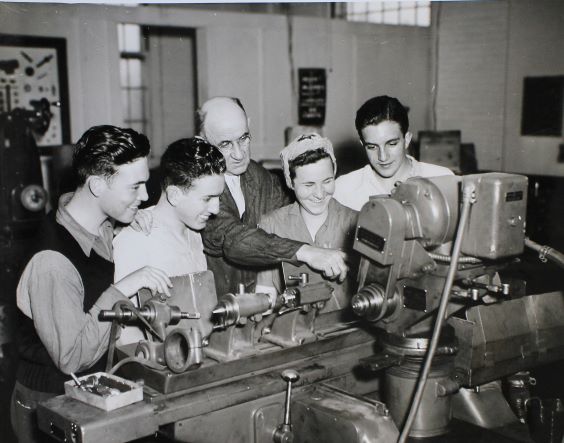 Young Men and Women in a Workshop